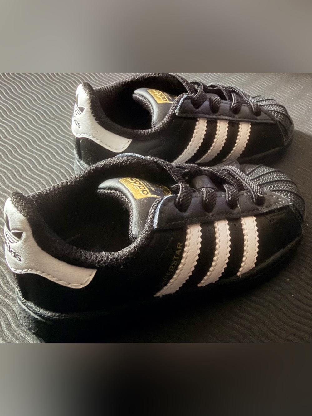 Adidas Kids Black and White Superstar Sneakers with Gold Logo